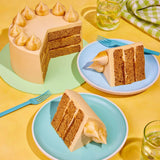 Classic Salted Caramel Cake with three layers of salted caramel sponge and buttercream, decorated with caramel blobs.